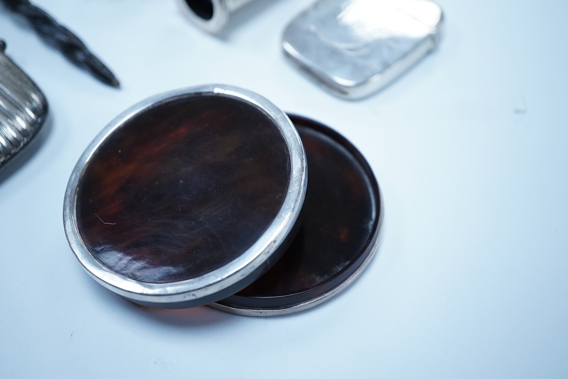 A group of assorted silver, to include a pair of modern five bar toast racks, a George V card case, a sterling vesta case, four assorted condiments, two mounted toilet bottles, mounted timepiece, a modern wooden handled